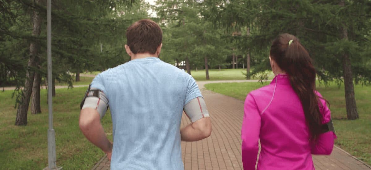 Two people walking together in a park